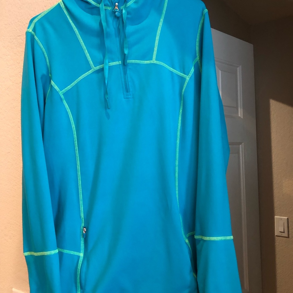 Kirkland Blue long Sleeve Front Zip Top with Hood. 85% Polyester, 15% Spandex.